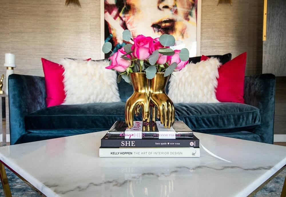 coffee-table-book-decor-with-gold-arteriors-hand-vase-and-pink-roses.jpg