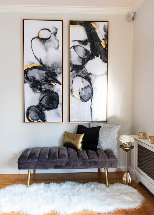 contemporary-black-and-gold-art-with-gray-velvet-bench-fur-rug-600x836