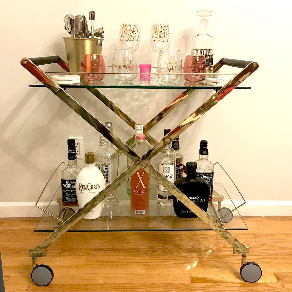 gold-bar-cart-with-pink-accessories-for-bar