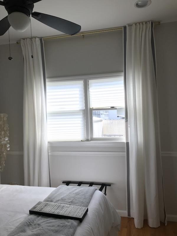 white-window-treatments-with-gray-border-tape-2.jpg